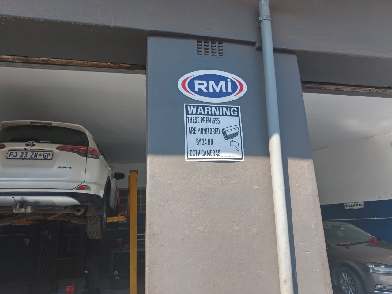 RMI accredited workshop with vehicle on the lift